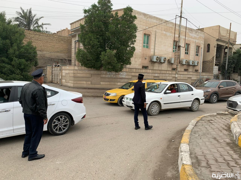 بالصور: رجال المرور في شوارع الناصرية وتقاطعاتها