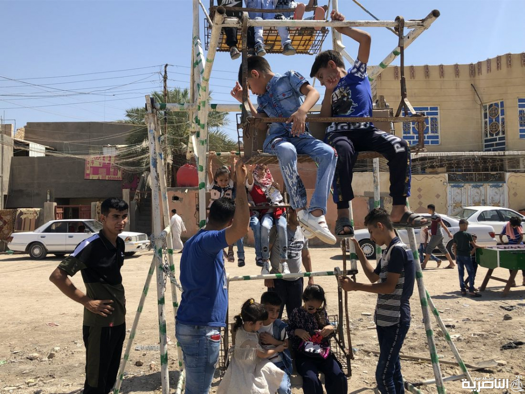 بالصور:اطفال ذوي الدخل المحدود يقضون اول ايام عيد الفطر بساحات خاوية