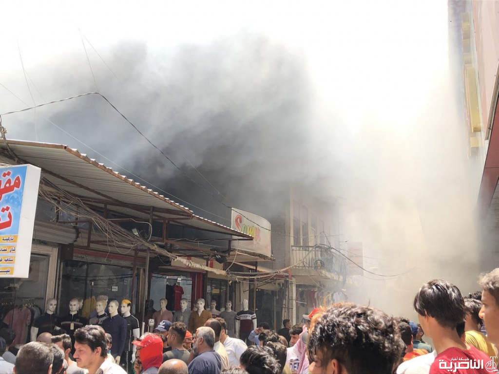 النيران تلتهم سوقا ومقهى في شارع الجمهورية بالناصرية