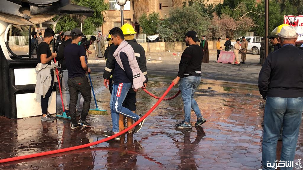 بالصور: حملة لتنظيف الشوارع والجسور الرئيسة في الناصرية