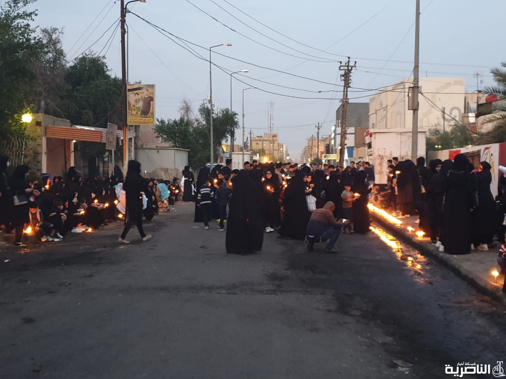بالصور: تظاهرة نسوية بالشموع لتخليد ذكرى شهداء الناصرية