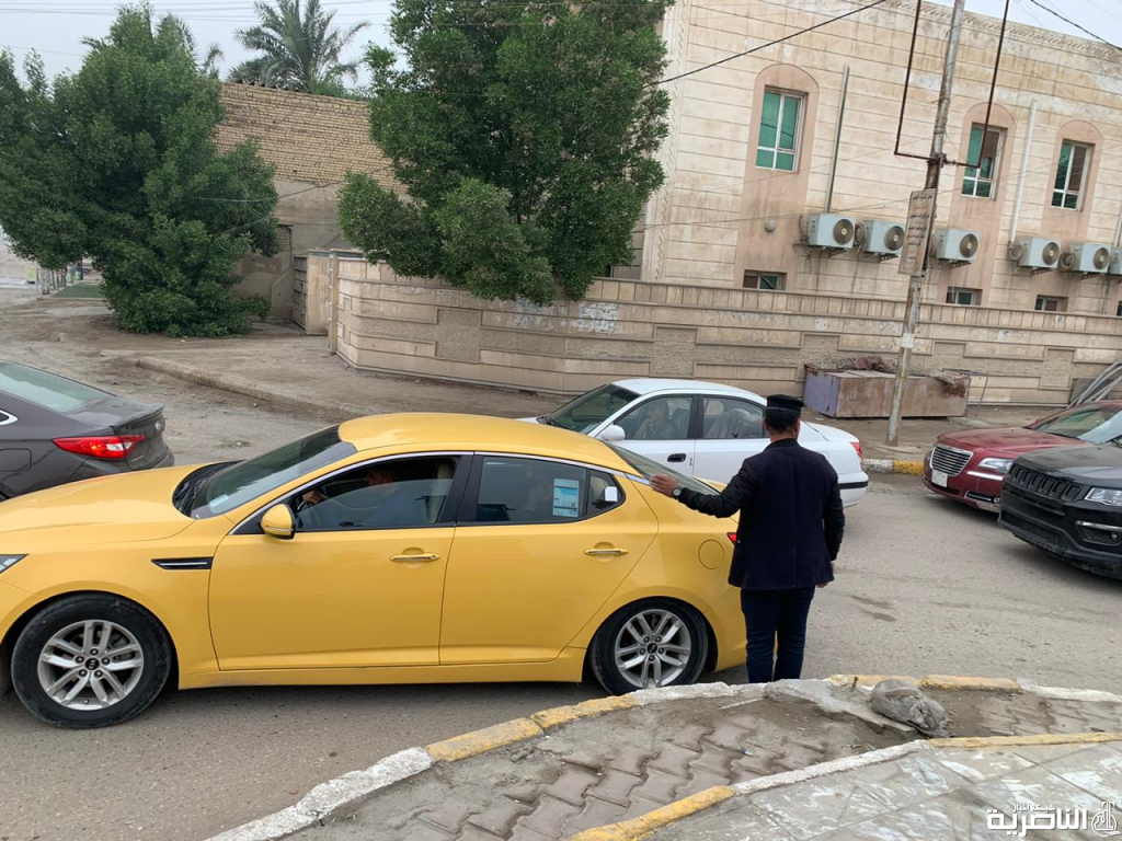 بالصور: رجال المرور في شوارع الناصرية وتقاطعاتها