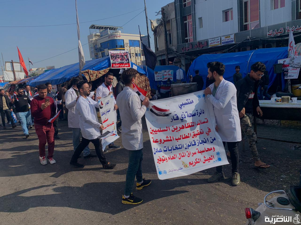 بالصور: الكوادر التمريضية والاسعاف الفوري تنظم مسيرة الية في ساحة الحبوبي دعما لمطالب المتظاهرين