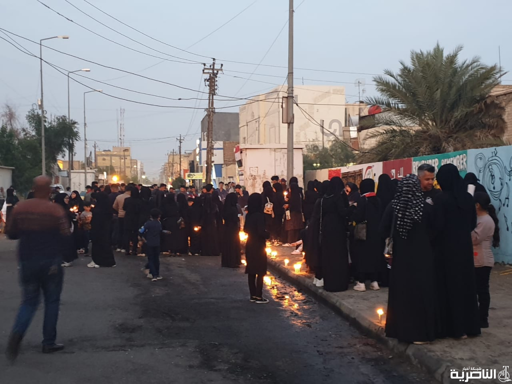بالصور: تظاهرة نسوية بالشموع لتخليد ذكرى شهداء الناصرية