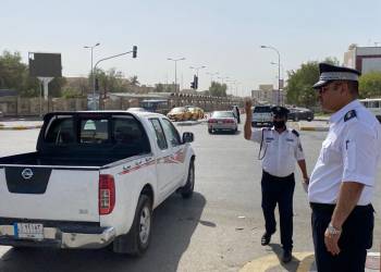 رجال الشرطة والمرور يواجهون شمس الناصرية الحارقة بأناقة المظهر وتفانٍ في العمل